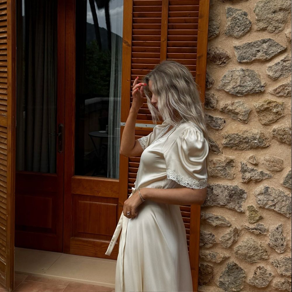 A woman in Mallorca wearing a delicate silky dress