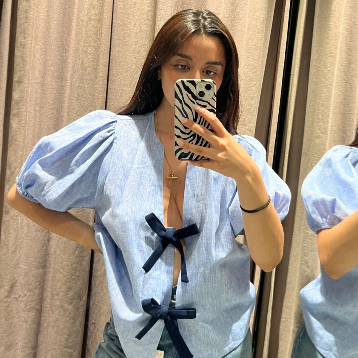 Senior Shopping Editor Marina Avraam wearing a blue summer top with bows from Zara