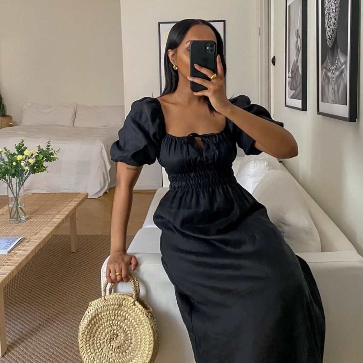 woman wearing black dress on sofa