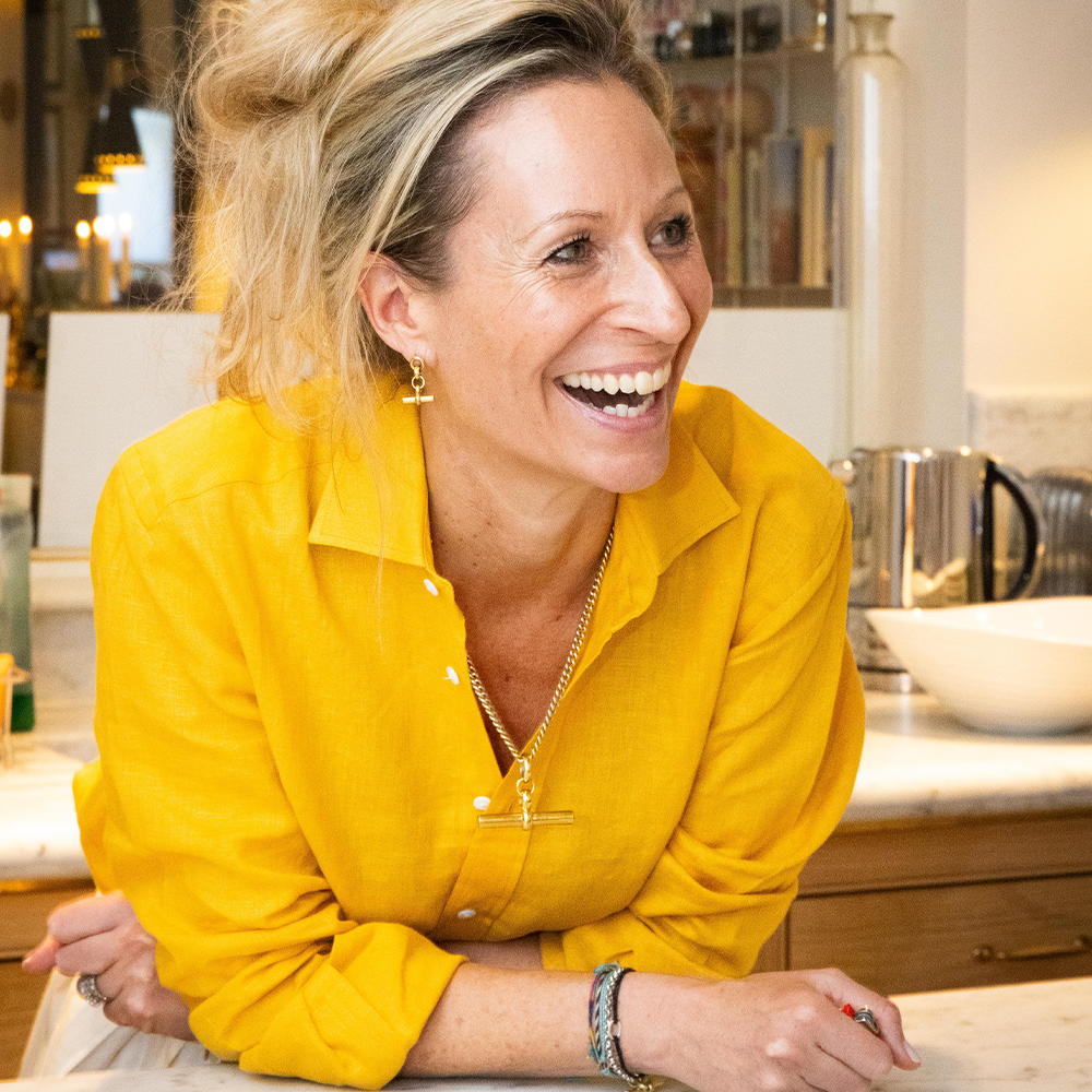 An image of jewellery designer Tilly Sveaas wearing a yellow shirt.